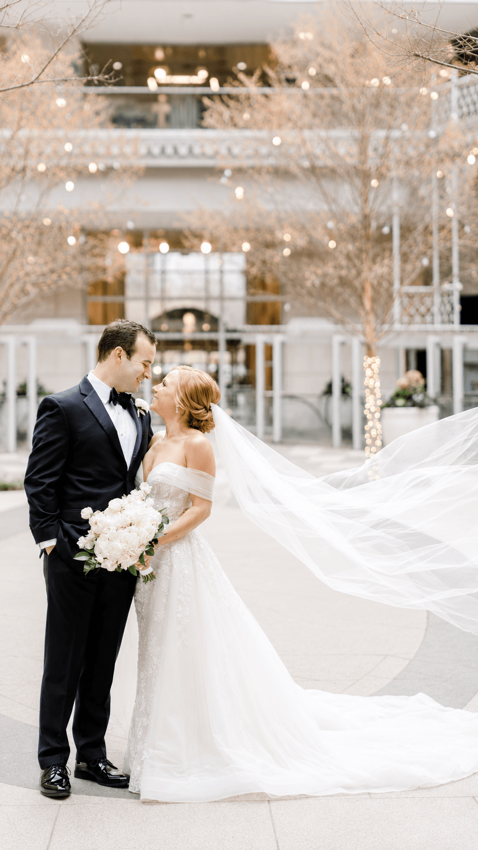 Couple with veil in the wind